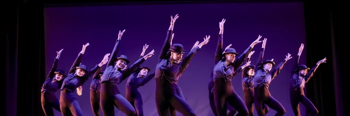 The Performance Collective company in unison on a New York City stage