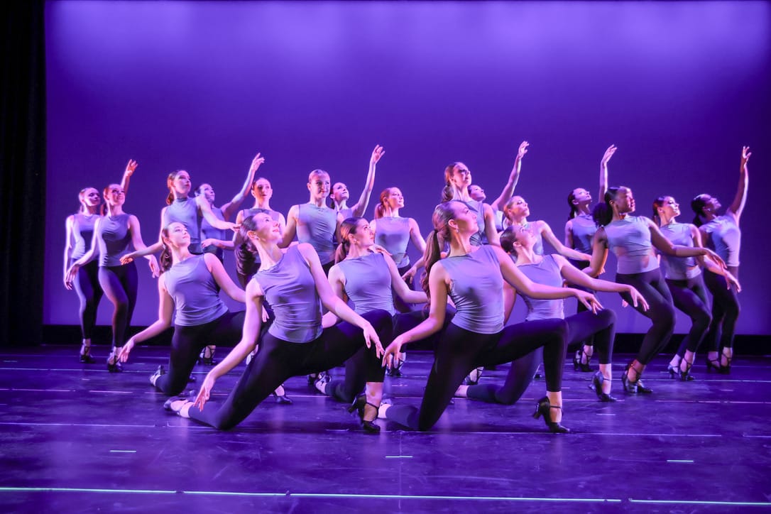 Dynamic group performance under purple stage lighting